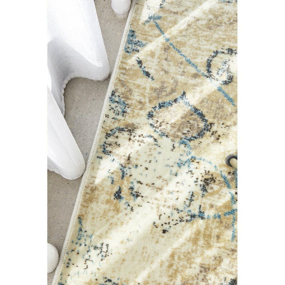 Calypso Bone Rug featuring abstract pattern in cream, beige and blue on ivory background, hand-tufted wool