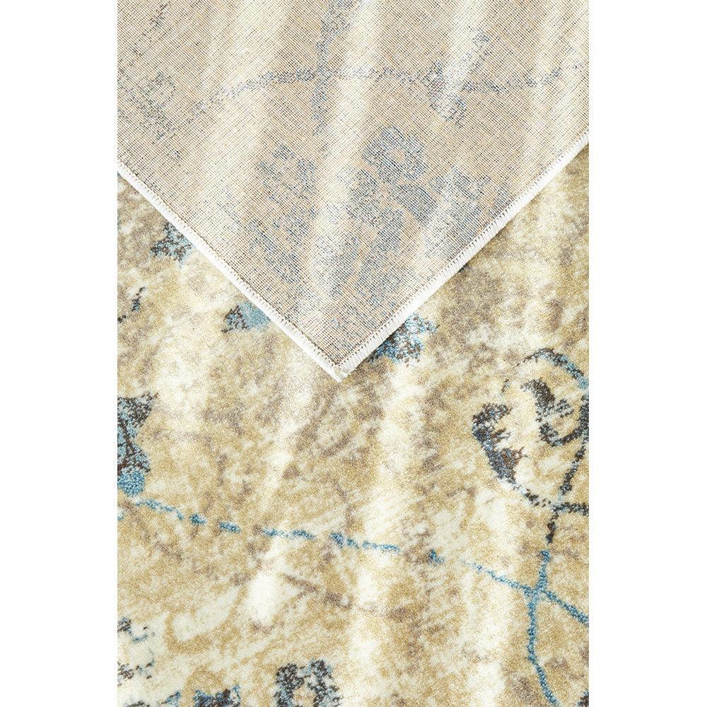 Calypso Bone Rug featuring abstract floral pattern in ivory, pale blue and taupe on warm beige background, power-loomed wool