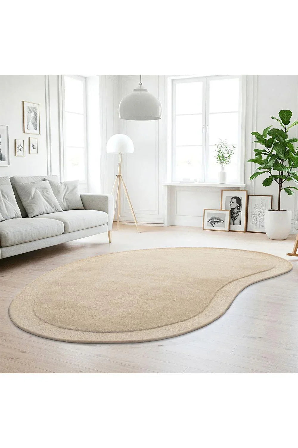 Cleo Beige Rug featuring organic curved silhouette in soft beige tones on light timber floor, hand-tufted wool