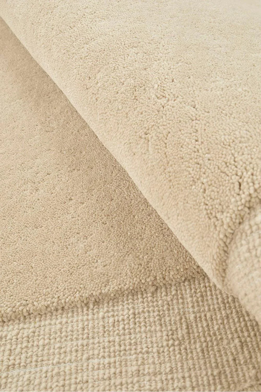 Cleo Beige Rug featuring soft boucle texture in warm beige and ivory on cream background, hand-tufted wool