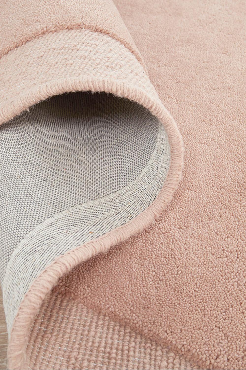Cleo Blush Rug featuring solid soft pile in blush pink on light grey backing, hand-tufted wool