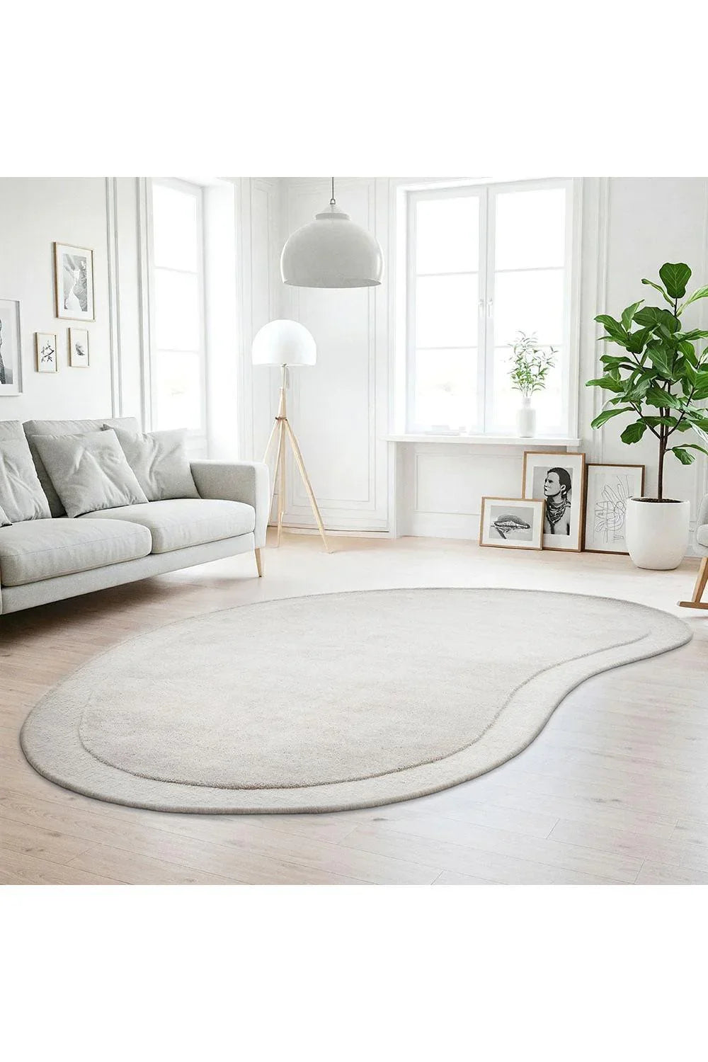 Cleo Dove Rug featuring soft curved design in ivory, cream and light beige on pale ivory background, hand-tufted wool