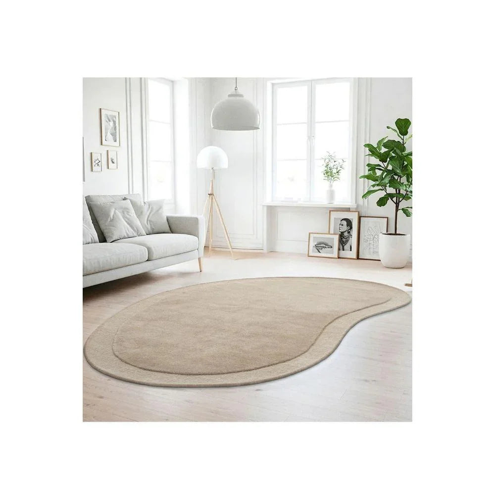 Cleo Latte Rug featuring soft curved outline design in latte beige on cream background, hand-tufted wool