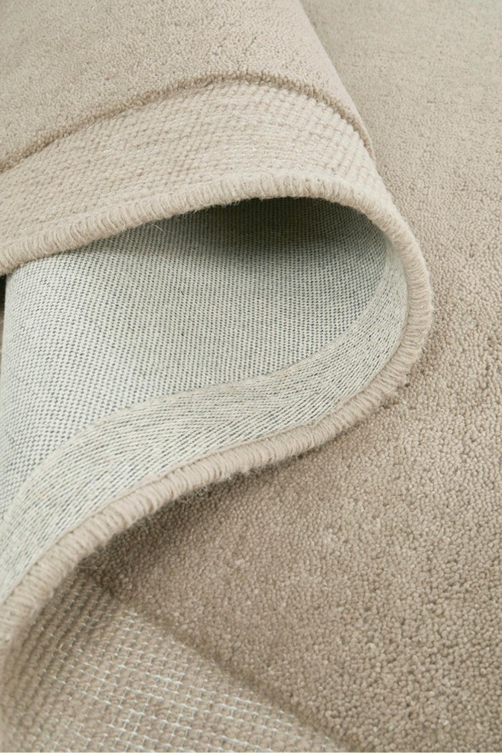 Cleo Latte Rug featuring textured solid field in taupe beige and cream on soft beige background, hand-tufted wool