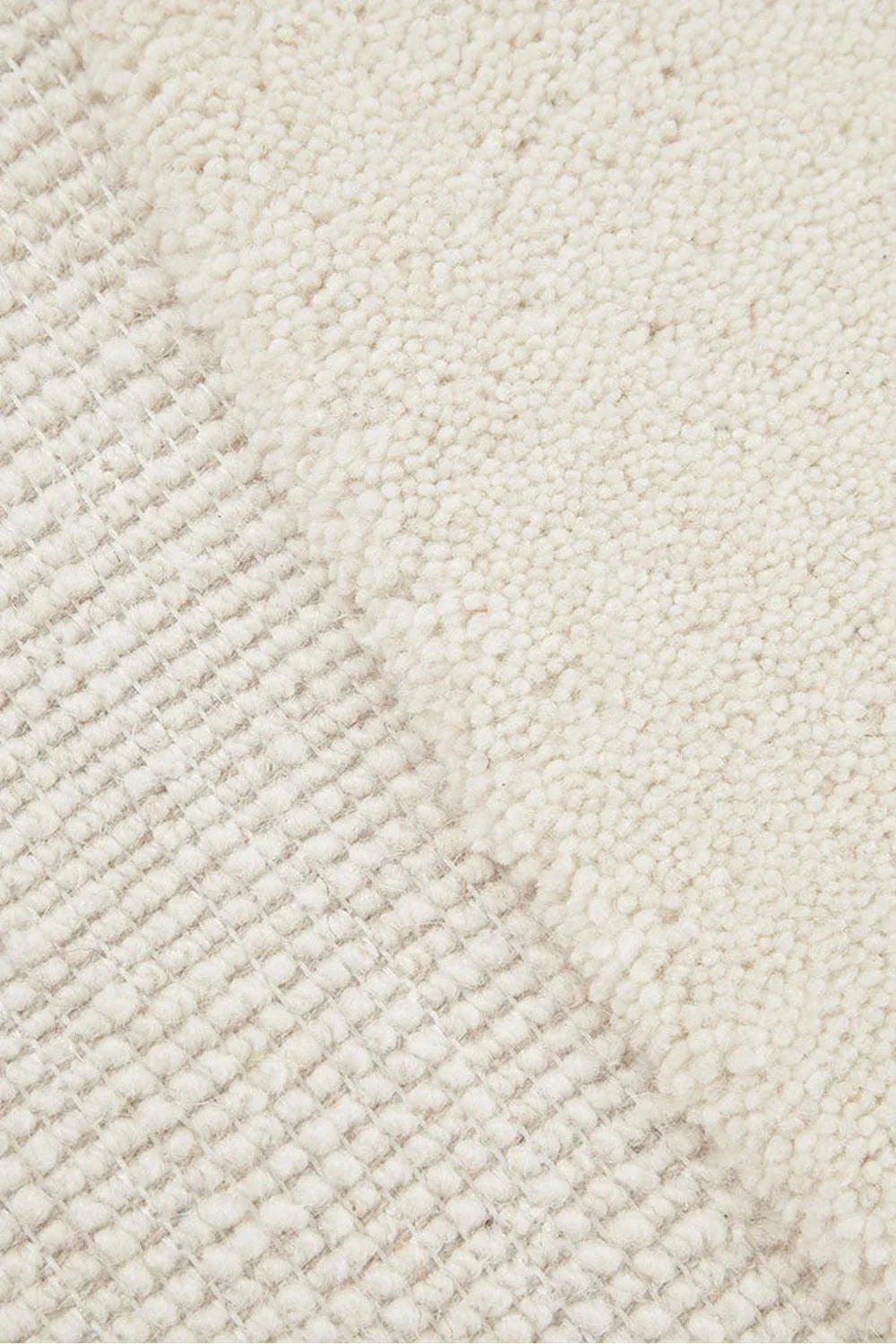 Cleo Milk Rug featuring soft curved line pattern in ivory, cream and beige on ivory background, hand-tufted wool