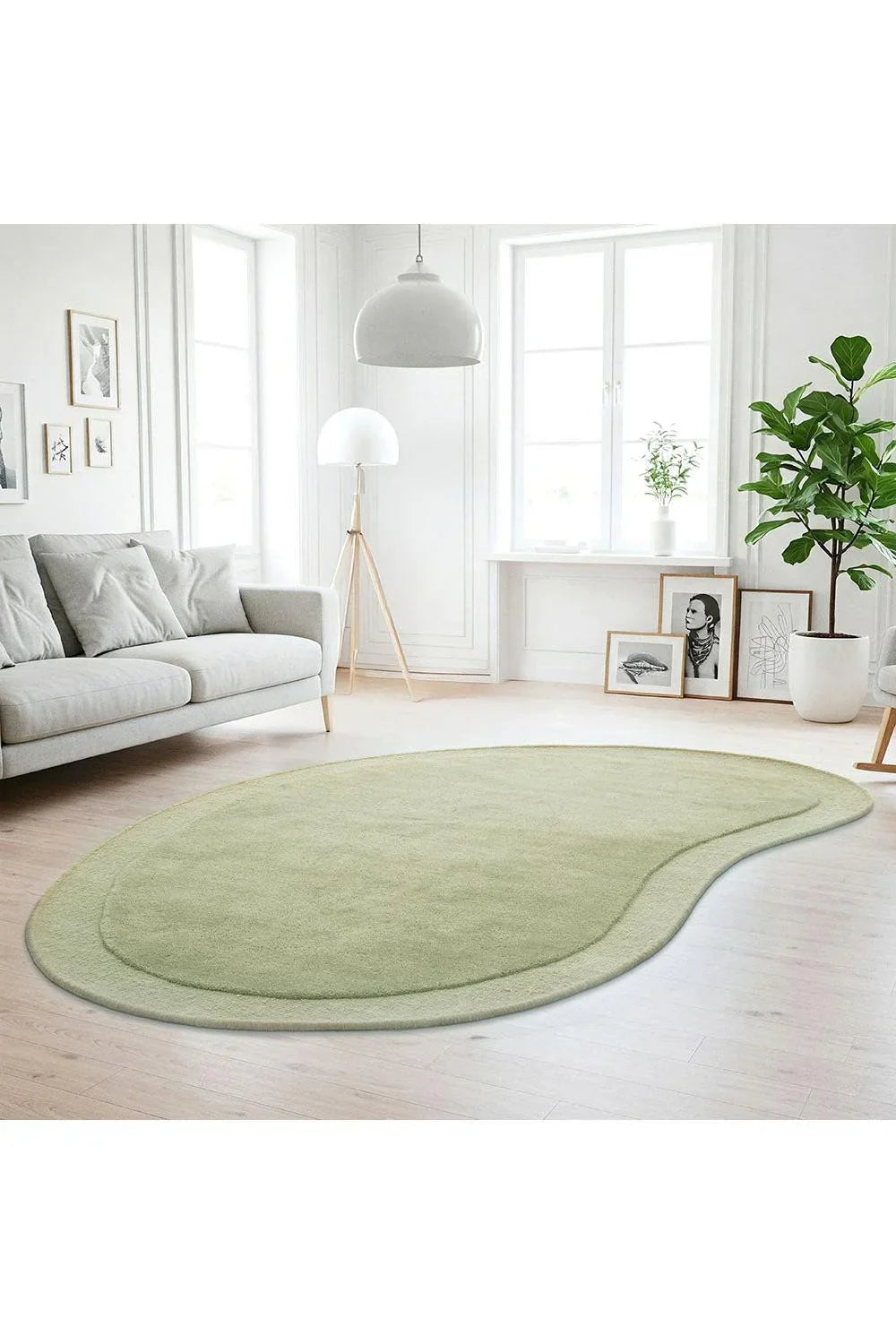 Cleo Moss Rug featuring curved silhouette in moss green and sage on pale cream background, hand-tufted wool