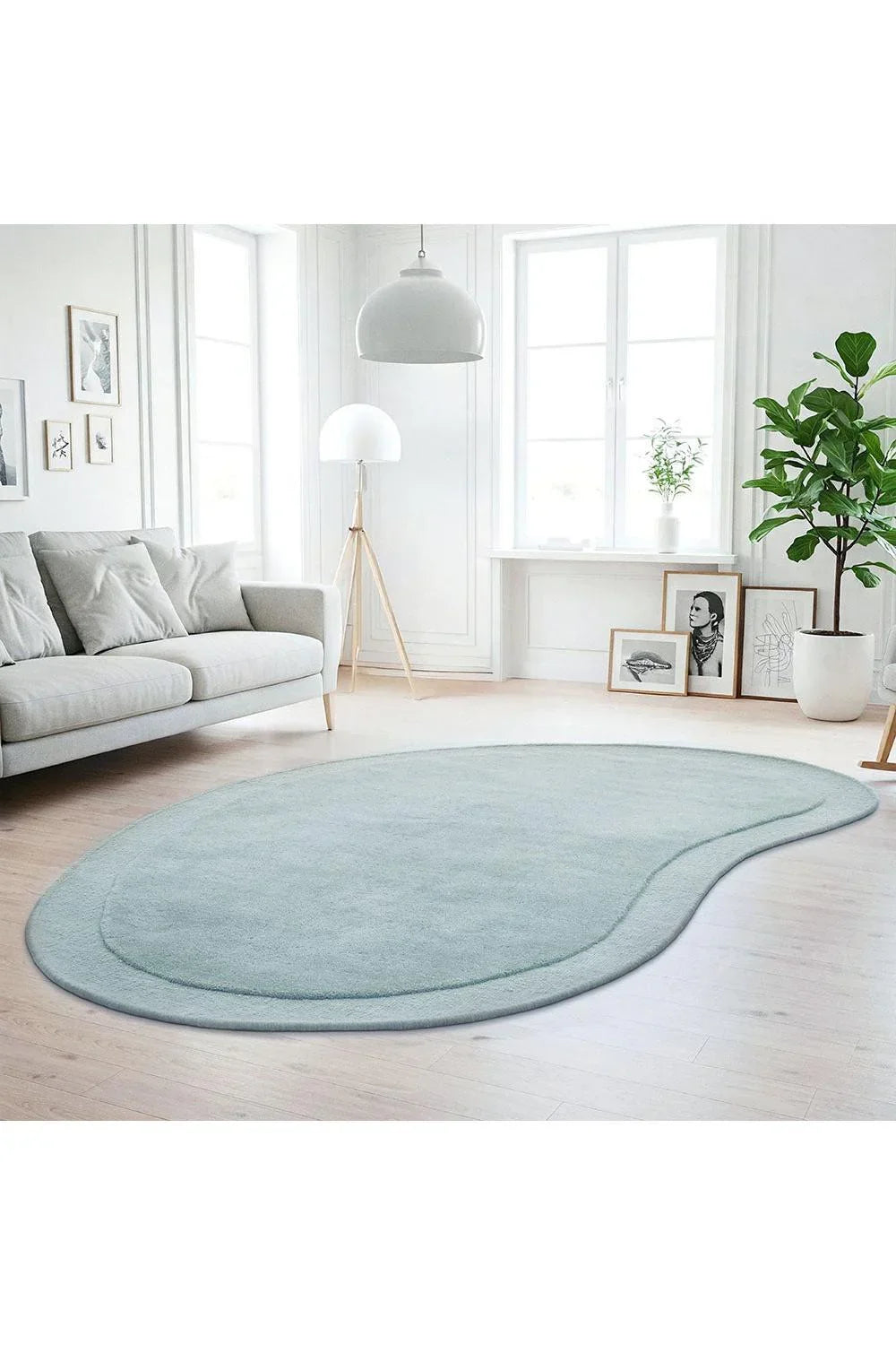 Cleo Sky Rug featuring soft curved kidney shape in sky blue, powder blue & pastel blue on cream background, hand-tufted wool
