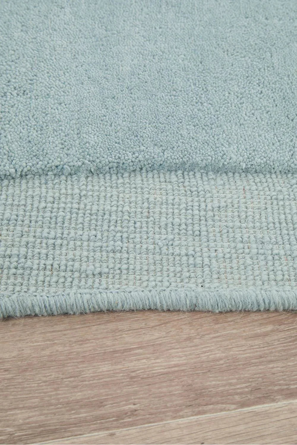 Cleo Sky Rug featuring soft shaggy texture in sky blue on pale blue background, hand-tufted wool