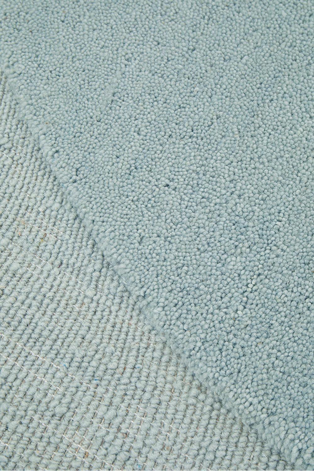 Cleo Sky Rug featuring soft textured pile in pale sky blue on light blue background, hand-tufted wool