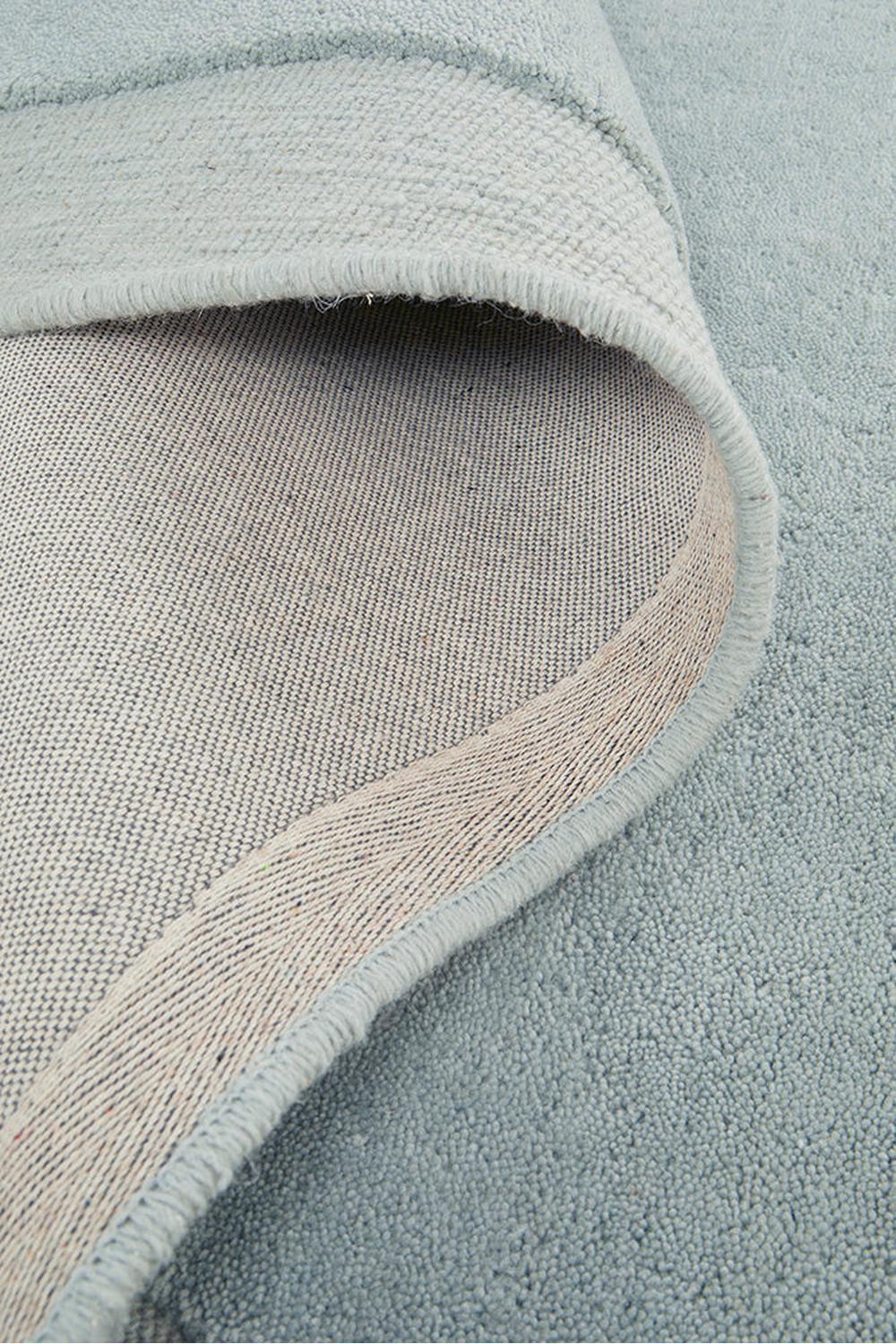 Cleo Sky Rug featuring solid textured weave in sky blue, pale blue and cream on light beige backing, hand-tufted wool
