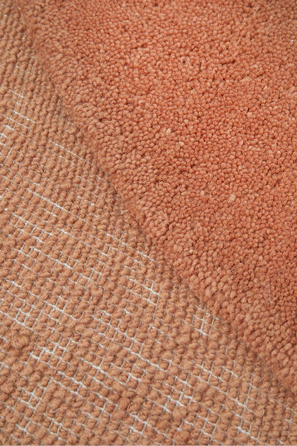 Cleo Spice Rug featuring geometric grid pattern in terracotta, ivory and beige on warm terracotta background, hand-tufted wool