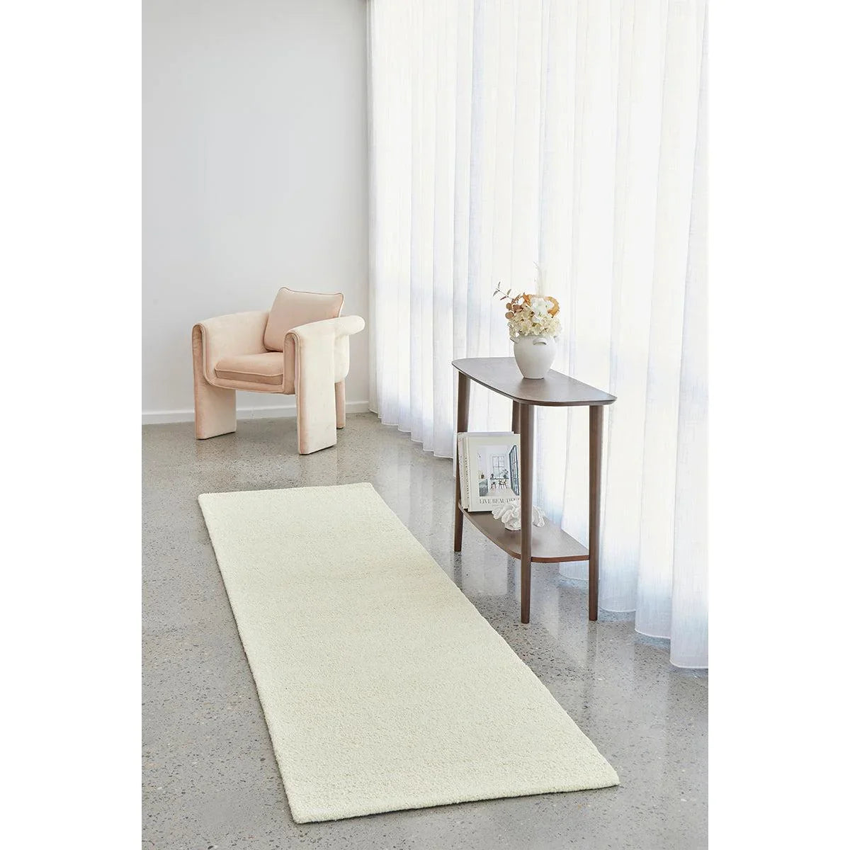 Conscious Loom Embrace Cream Runner Rug featuring minimalist design in cream ivory on grey floor, handwoven wool