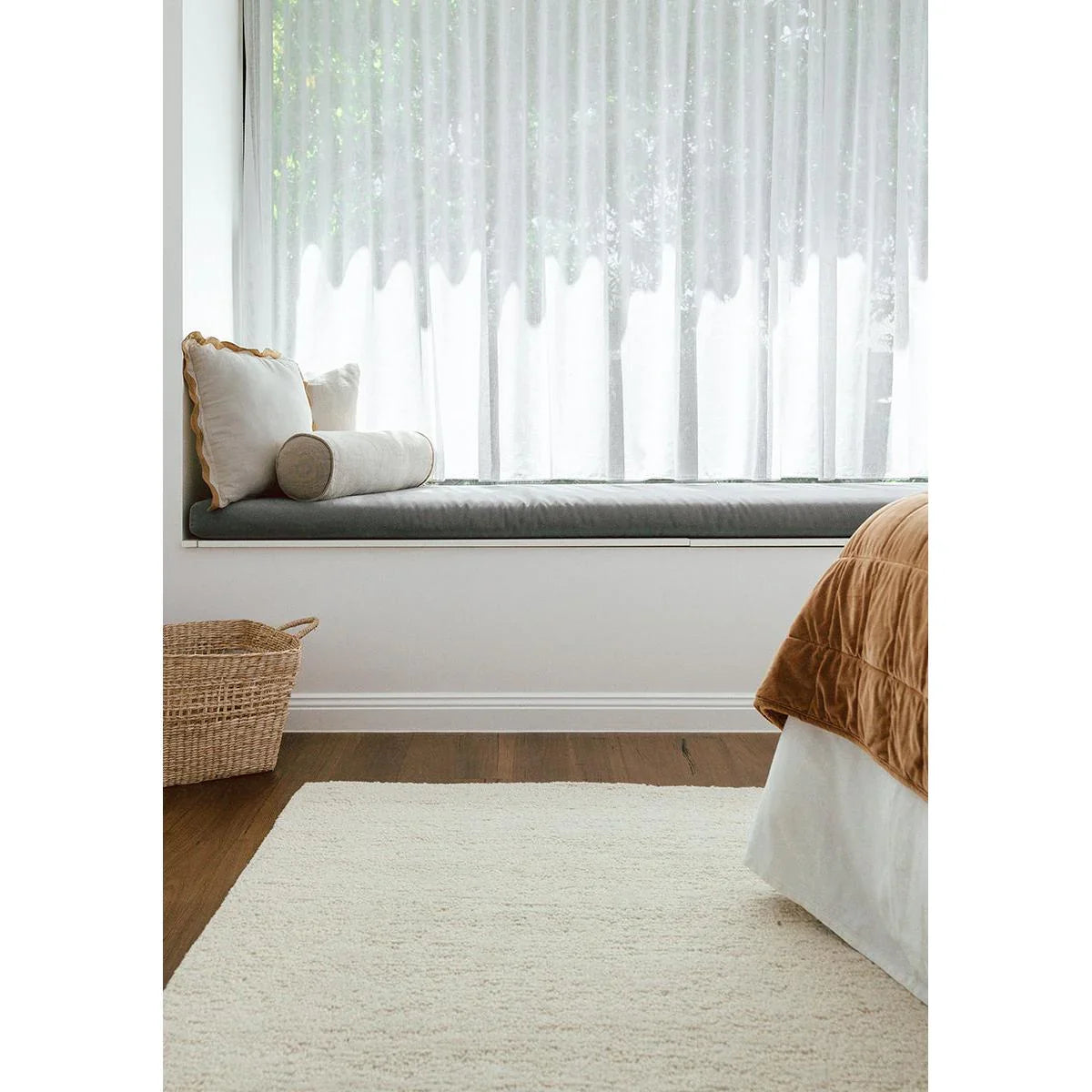 Conscious Loom Embrace Cream Rug featuring textured shag in cream, ivory on light oak floor, machine-woven polyester