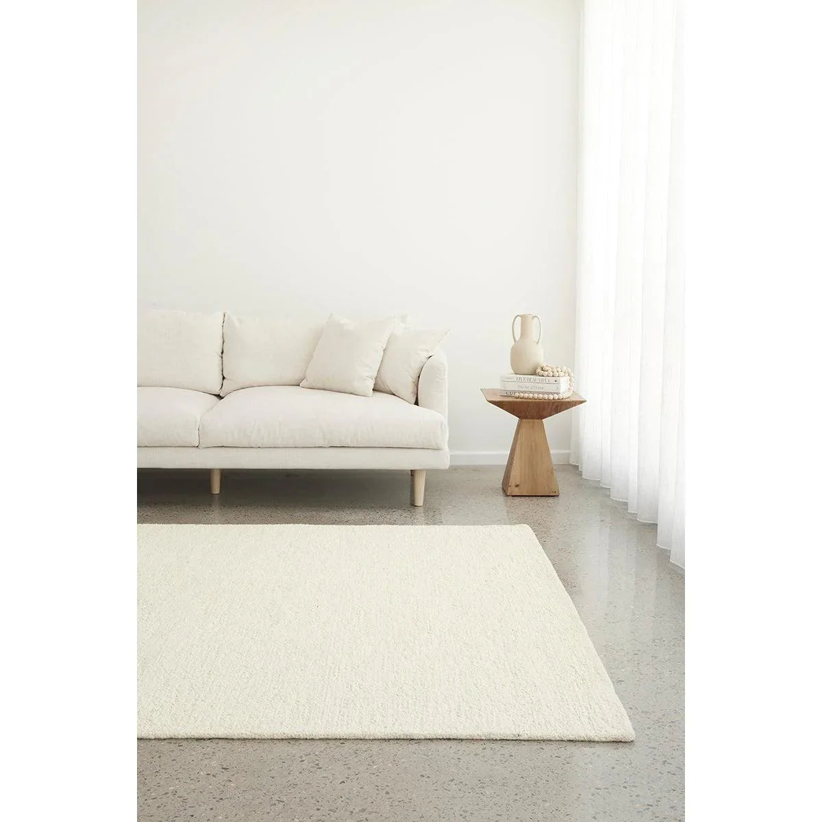 Conscious Loom Embrace Cream Rug featuring textured cream weave in ivory and white on pale beige, hand-tufted wool