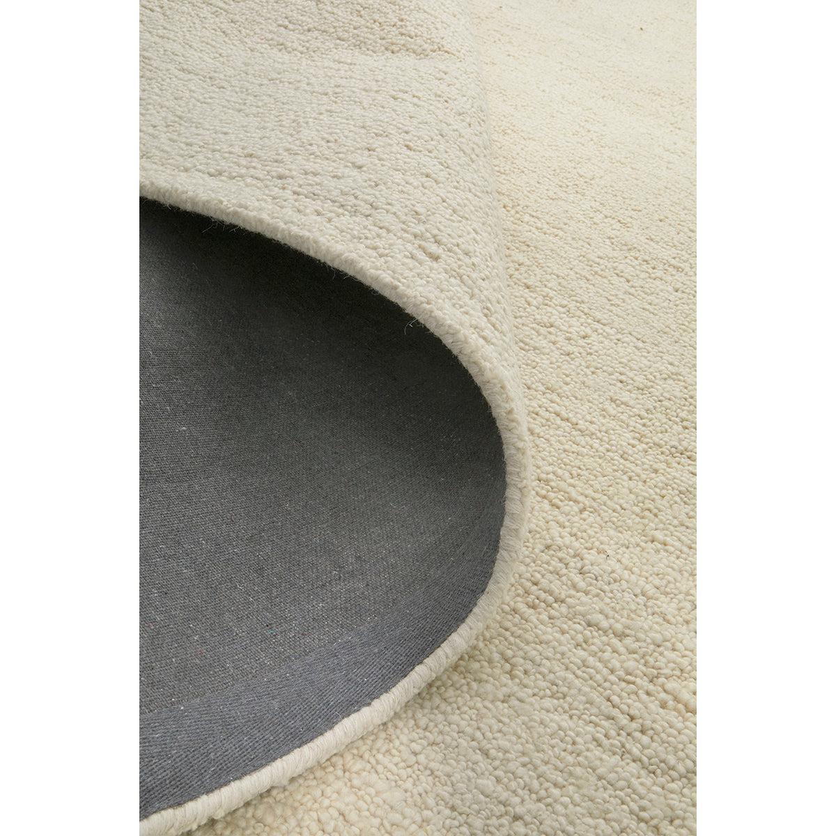 Conscious Loom Embrace Cream Rug featuring textured shag in cream and ivory on light beige background, hand-loomed wool