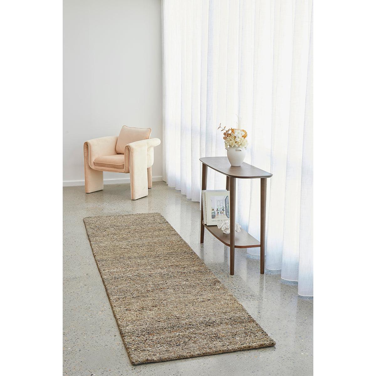 Conscious Loom Embrace Stone Rug featuring textured weave in stone, beige, taupe on light grey floor, hand-tufted wool