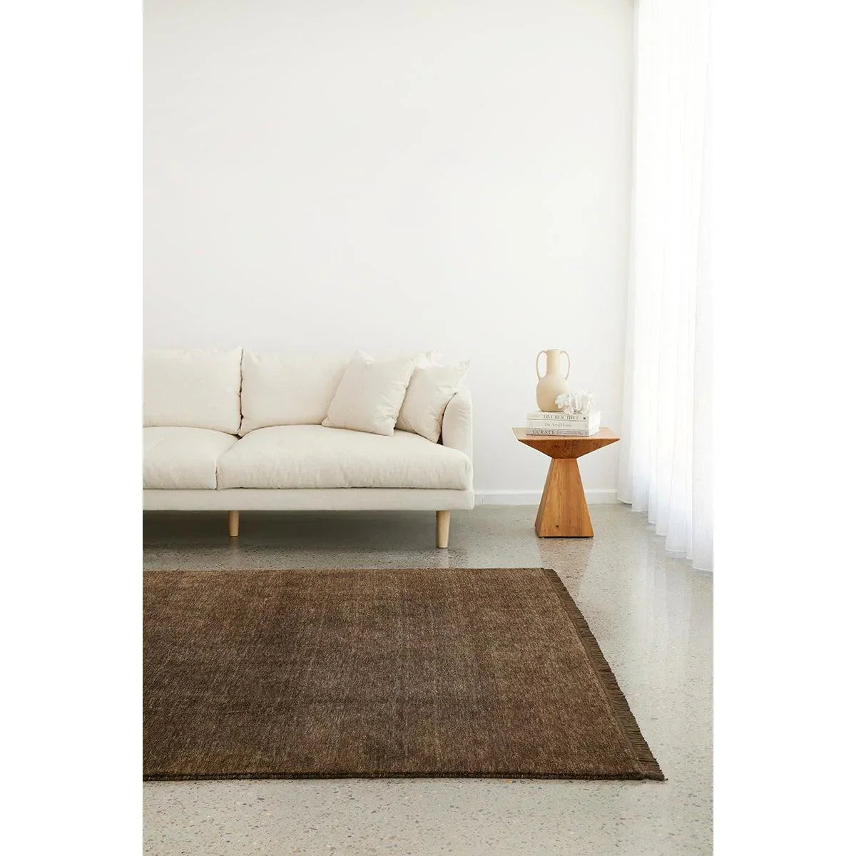 Conscious Loom Kinship Bear Brown Rug featuring solid color in dark chocolate brown on cream, hand-loomed wool