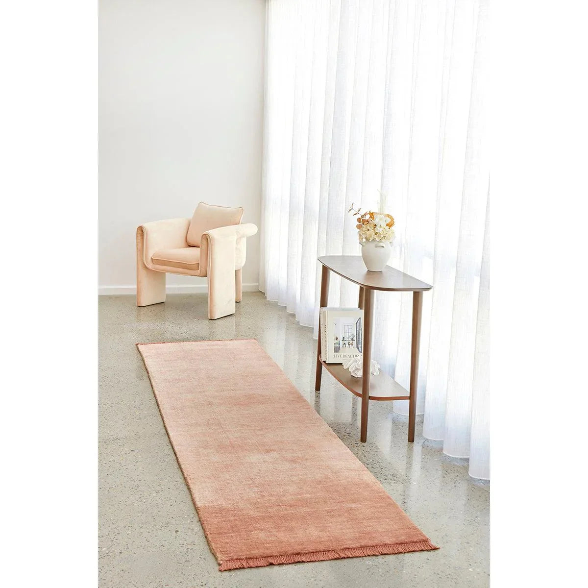 Conscious Loom Kinship Runner Rug featuring solid blush pink on light grey terrazzo floor, hand-loomed wool