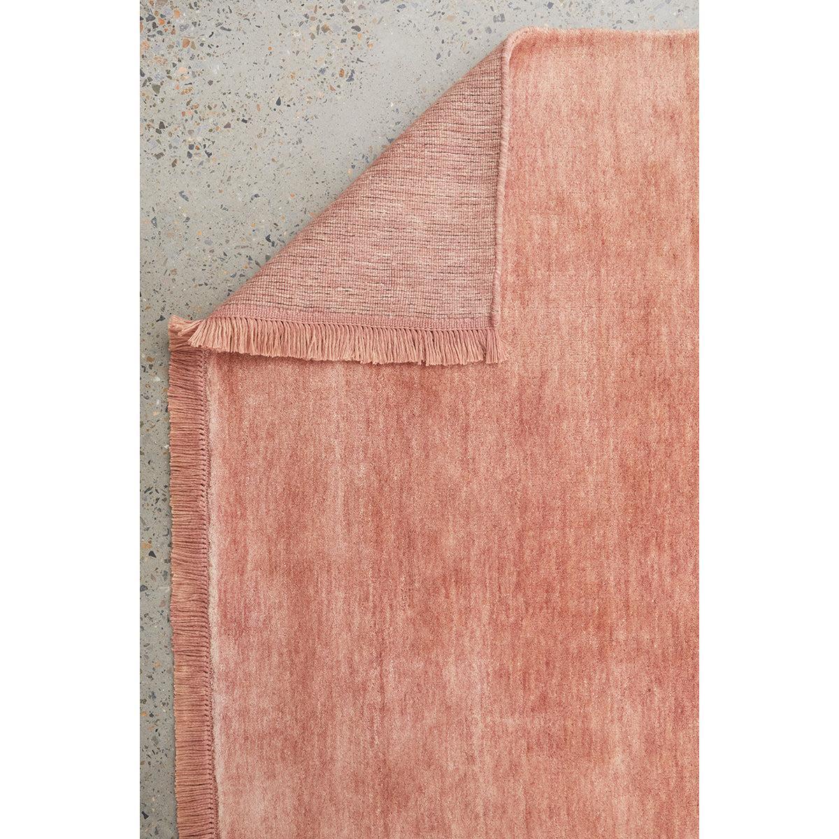 Conscious Loom Kinship Blush Pink Rug featuring solid tonal wash in blush pink, rose pink and peach on light grey background, woven cotton