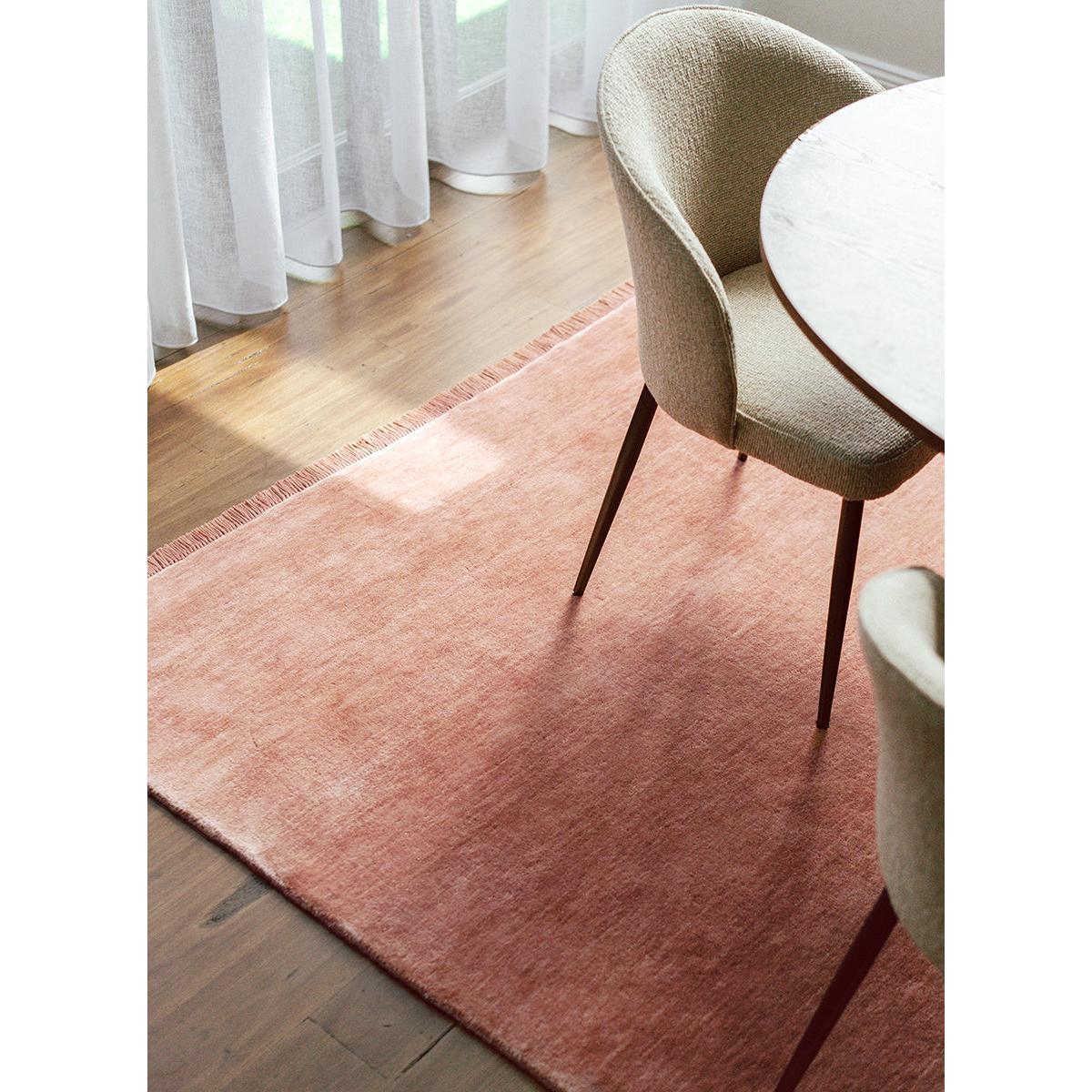 Conscious Loom Kinship Blush Pink Rug featuring solid colour in blush pink, ivory and beige on oak floor, hand-tufted wool