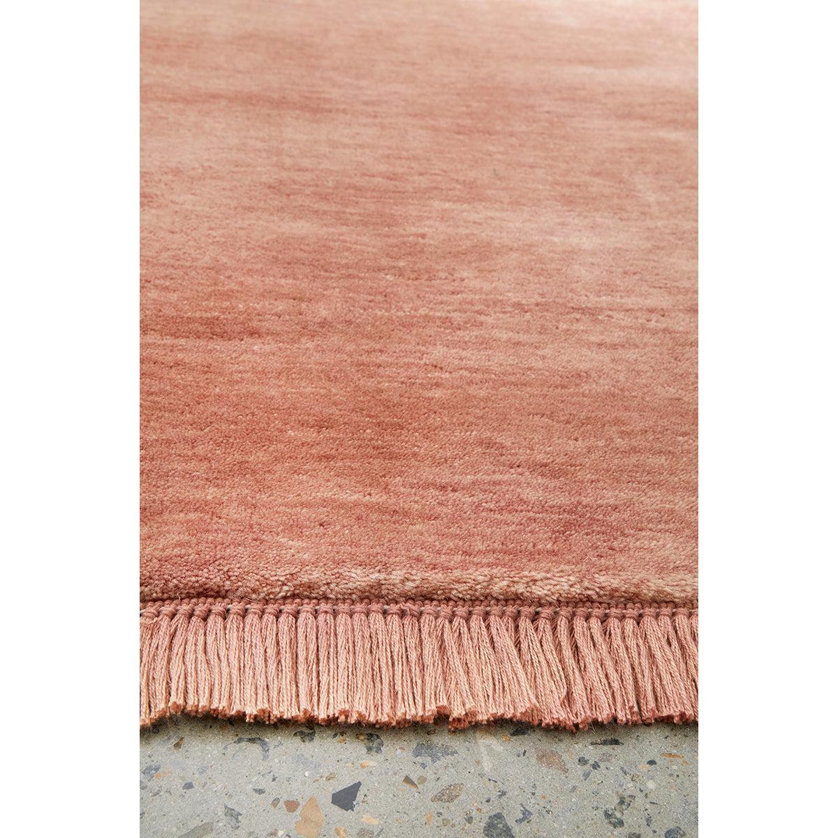 Conscious Loom Kinship Blush Pink Rug featuring solid blush-pink pile on pale rose-grey background, handwoven wool