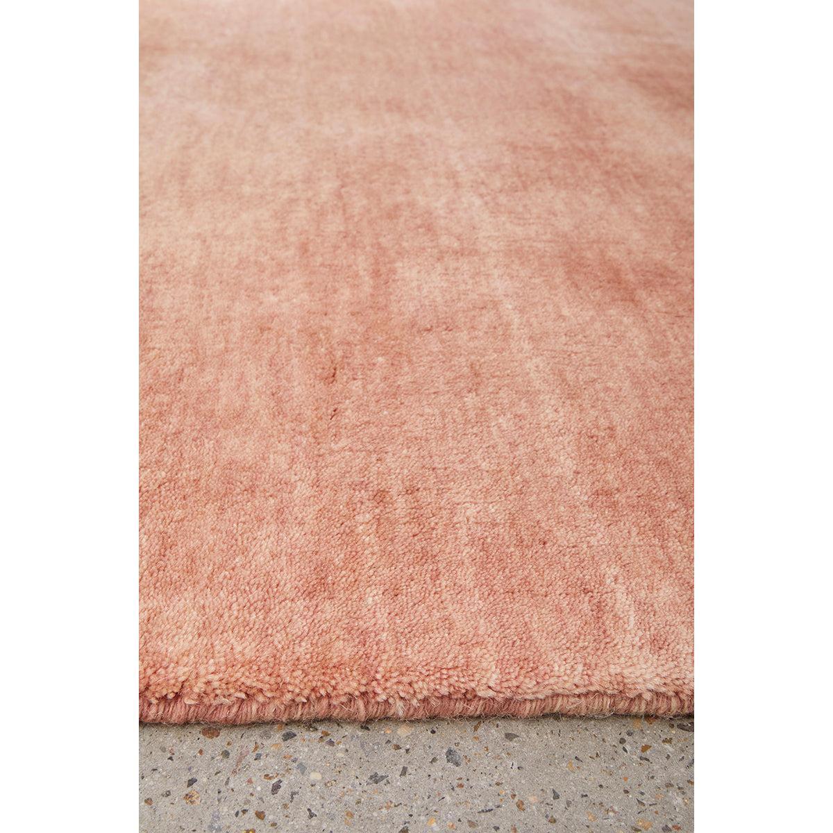 Conscious Loom Kinship Blush Pink Rug featuring solid shag in blush pink on light grey floor, hand-tufted wool