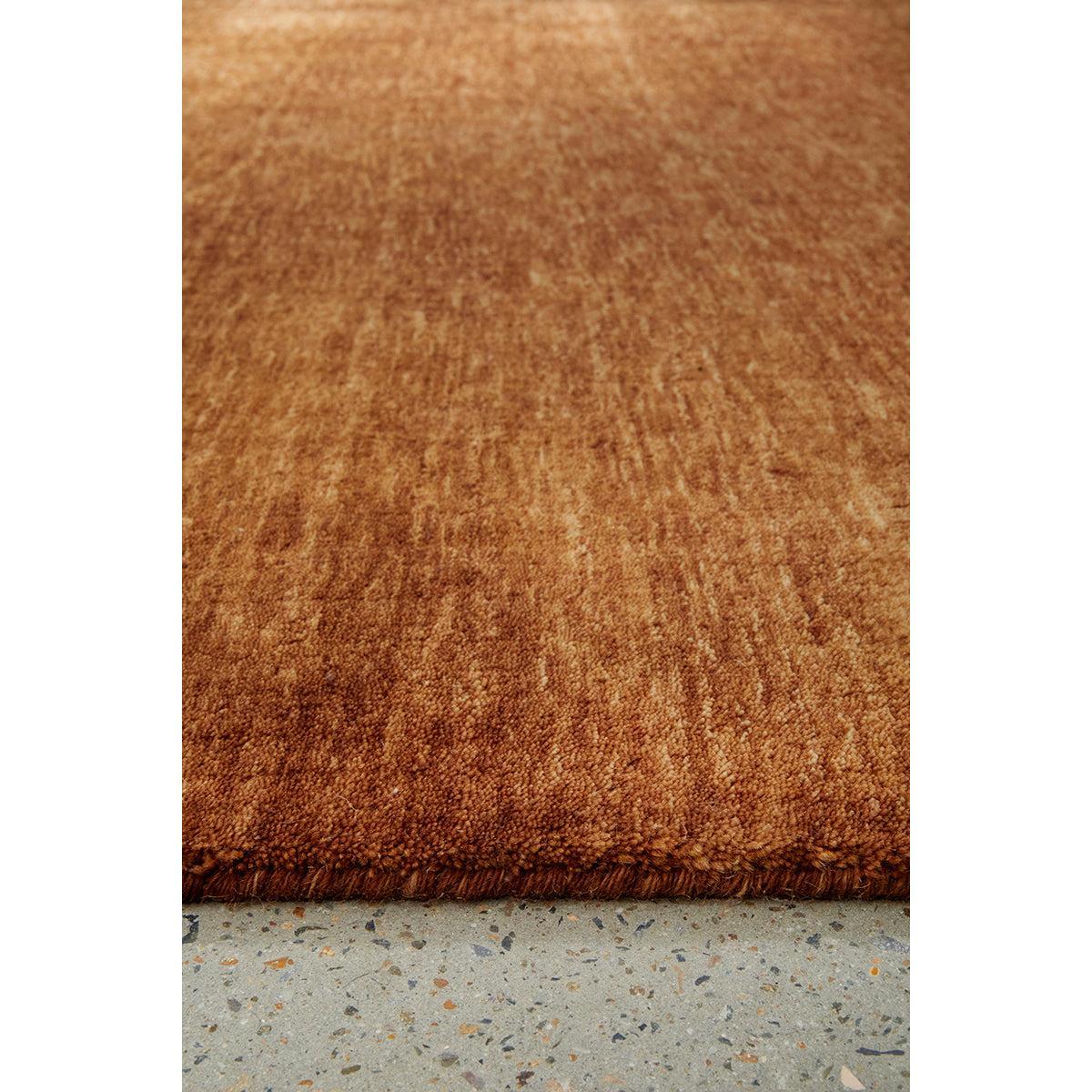Conscious Loom Kinship Caramel Runner Rug featuring textured pattern in caramel chestnut copper on grey hand-loomed wool