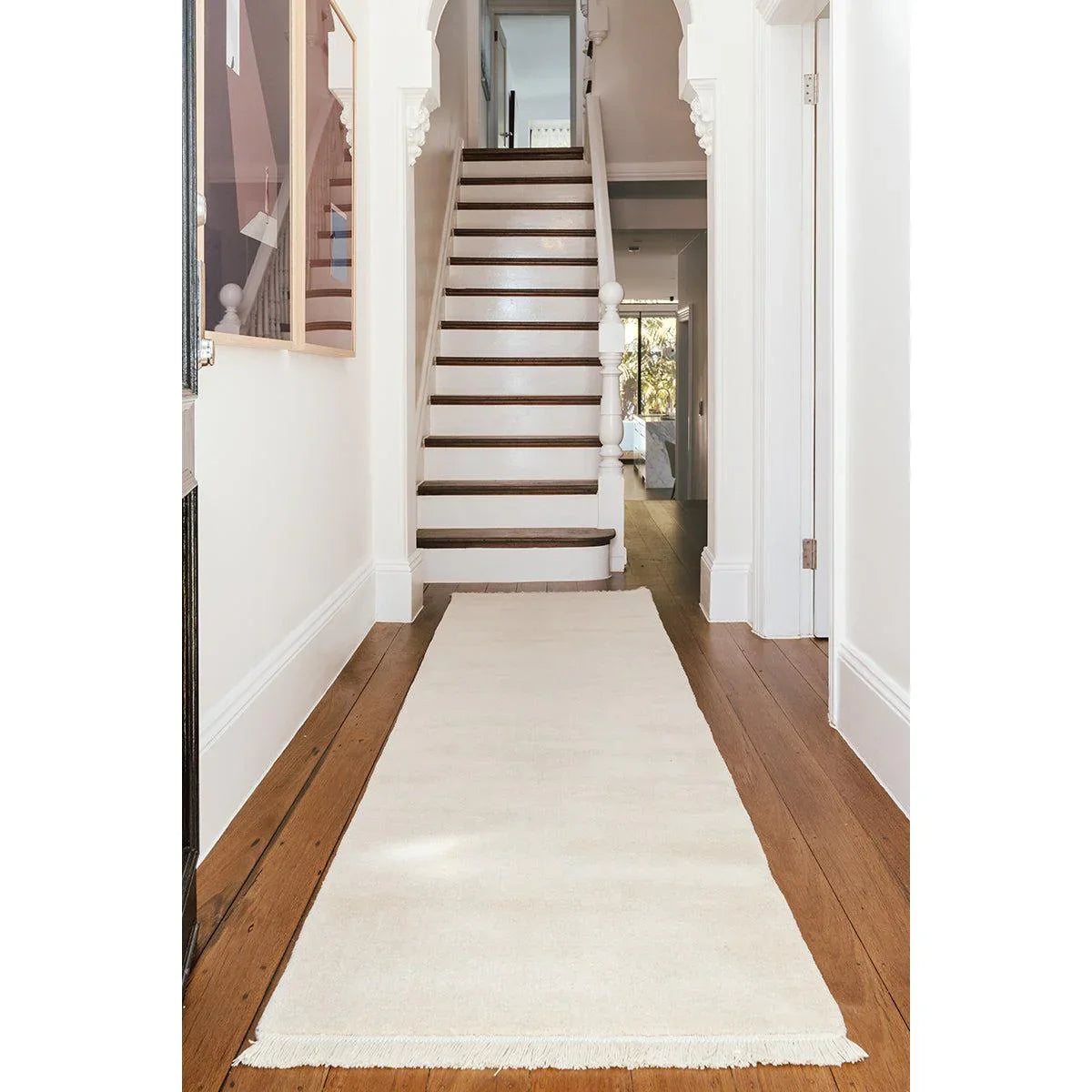 Conscious Loom Kinship Cream Runner Rug featuring solid cream/ivory/white on warm brown wooden floor, hand-loomed wool