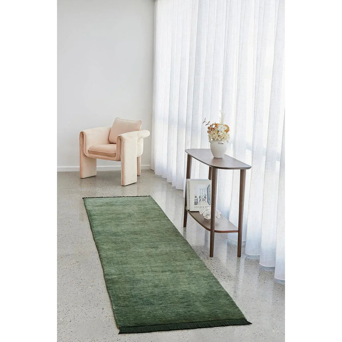 Conscious Loom Kinship Forest Green Runner Rug featuring textured forest green and cream on light grey floor, hand-woven wool