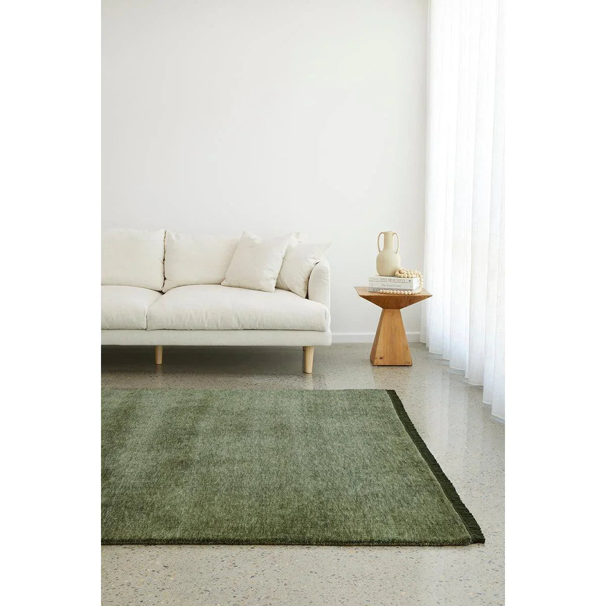 Conscious Loom Kinship Forest Green Rug featuring textured weave in forest green and olive on cream background, handwoven wool