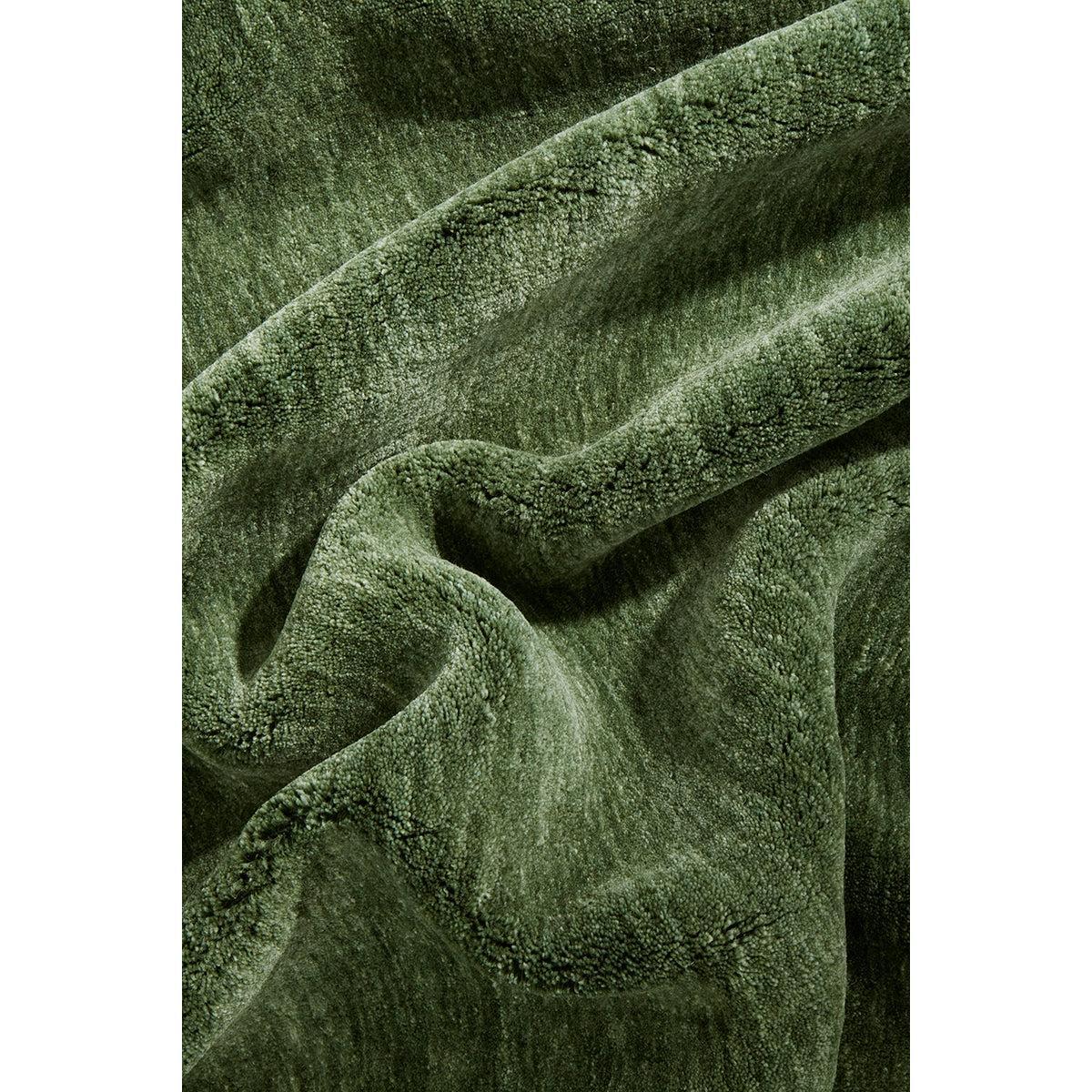 Conscious Loom Kinship Forest Green Rug featuring textured plush pile in forest green on white background, hand-tufted wool