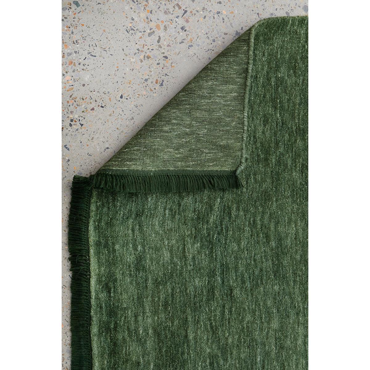 Conscious Loom Kinship Forest Green Rug featuring pattern in forest green, olive and moss on grey bg, tufted wool