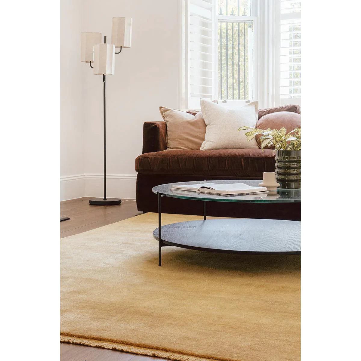 Conscious Loom Kinship Honey Rug featuring solid design in honey, beige and cream on light beige floor, hand-loomed wool