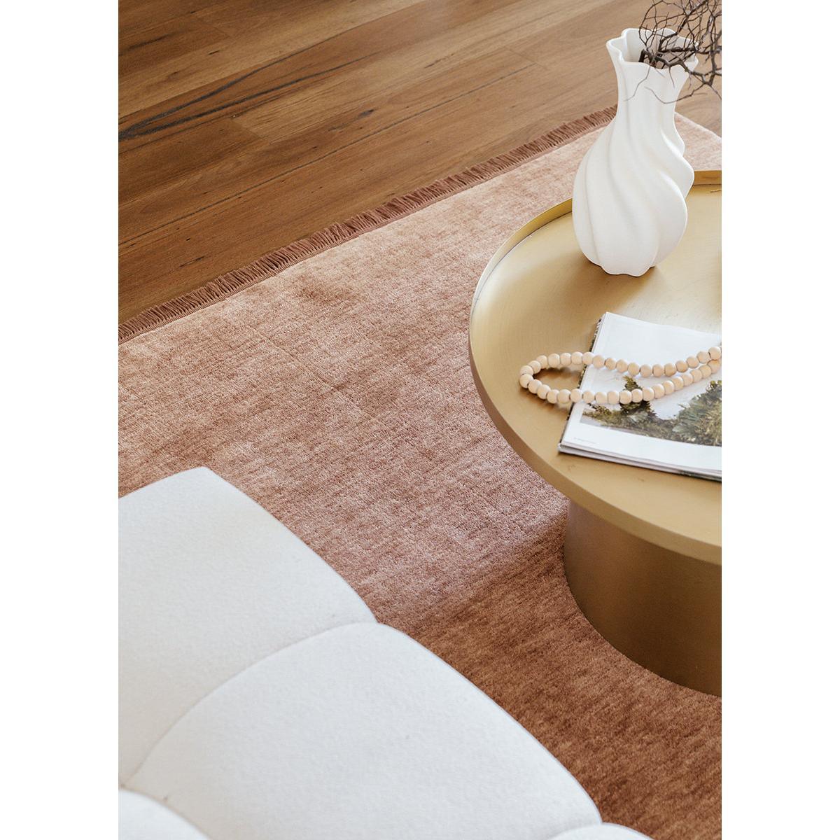 Conscious Loom Kinship Mocha Mousse Rug featuring solid mocha, mauve and blush tones on brown floor, hand-tufted wool