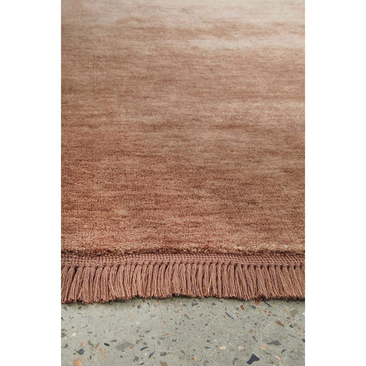 Conscious Loom Kinship Mocha Mousse Rug featuring solid design in mocha, brown, taupe on grey background, woven wool
