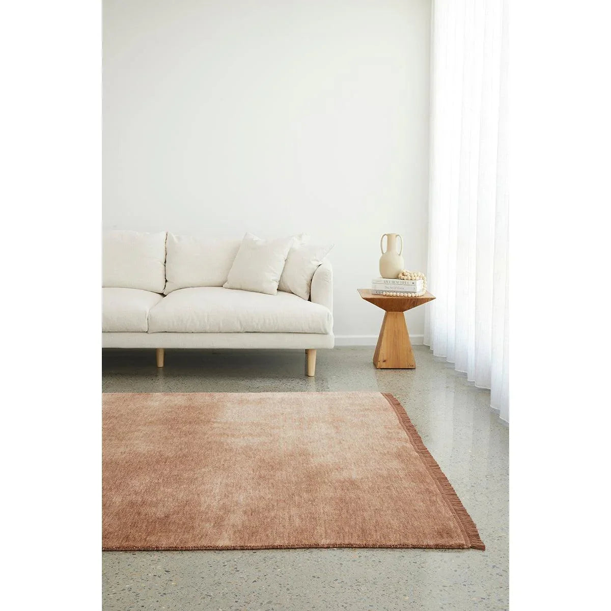 Conscious Loom Kinship Mocha Mousse Rug with solid-colour design in mocha mousse, cream and taupe on light grey floor, handwoven wool
