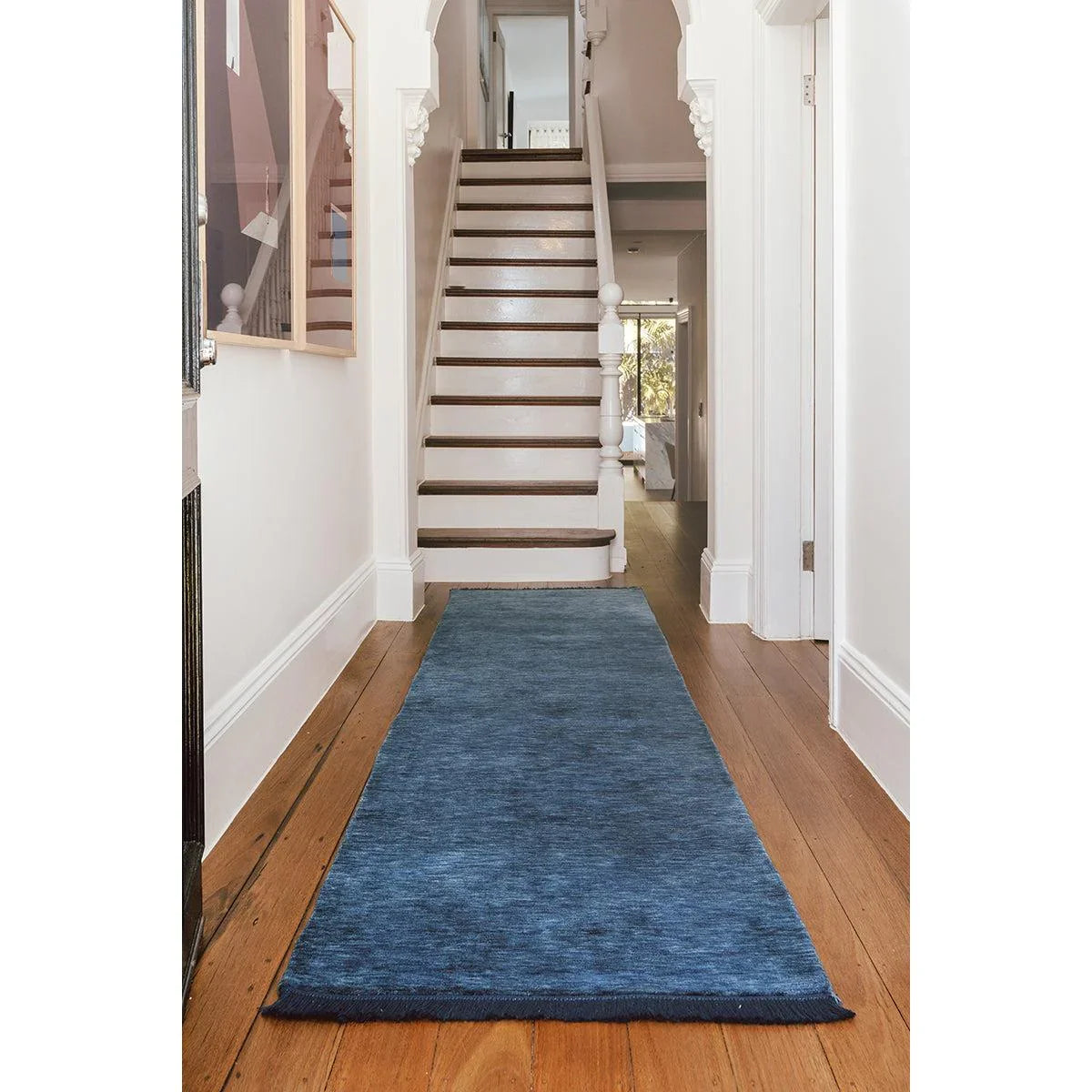 Conscious Loom Kinship Navy Runner Rug featuring solid color in navy blue on warm brown hardwood, hand-woven wool