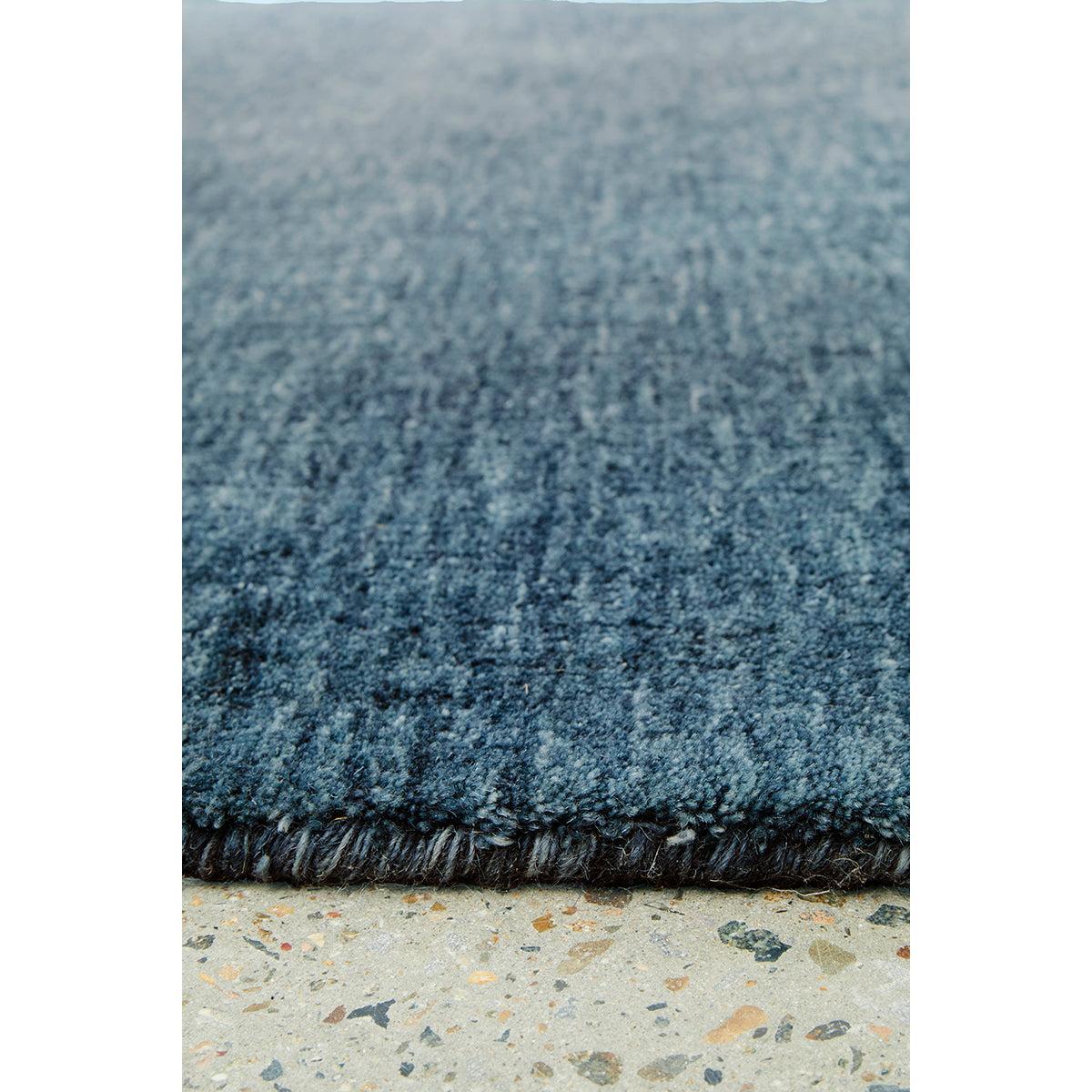 Conscious Loom Kinship Navy Runner Rug tonal gradient in navy blue, steel blue and indigo on beige terrazzo, woven wool