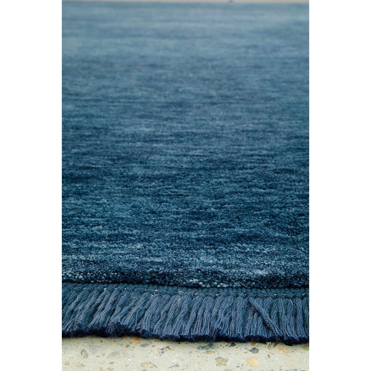 Conscious Loom Kinship Navy Rug featuring textured weave in navy, cobalt and azure on beige background, hand-tufted wool