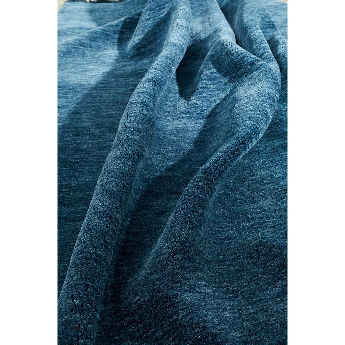 Conscious Loom Kinship Navy Rug featuring pattern in navy, cobalt blue and teal on white background, hand-loomed wool
