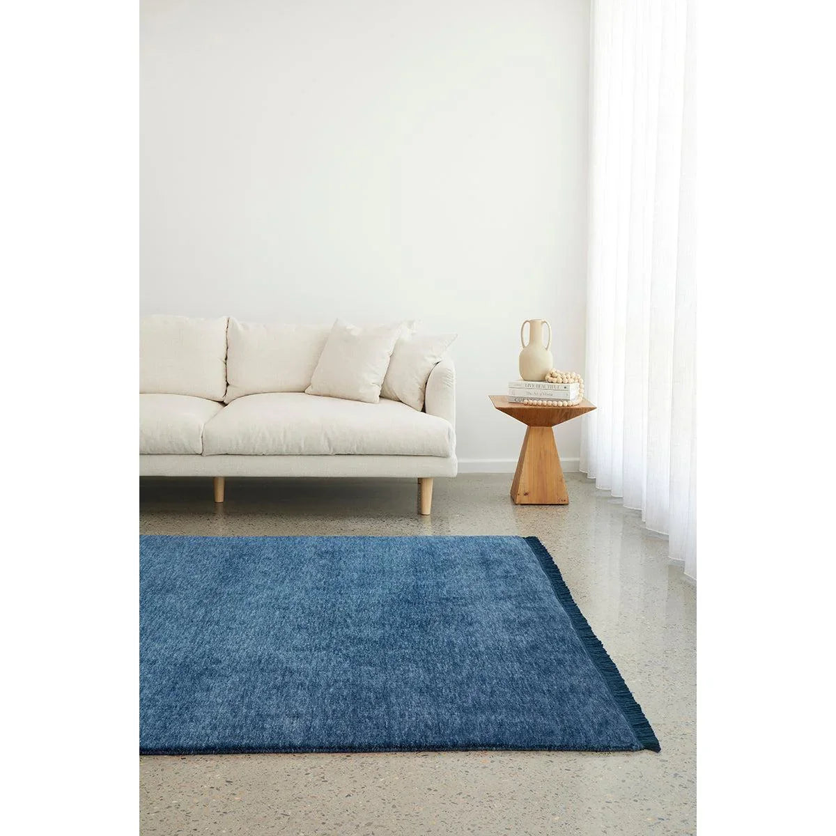 Conscious Loom Kinship Navy Rug featuring solid textured weave in navy and indigo on cream background, hand-woven wool