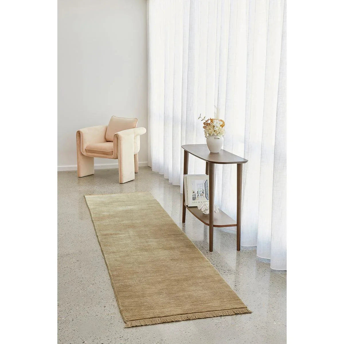 Conscious Loom Kinship Oyster Rug with minimalist flatwoven design in oyster beige on pale grey floor, handwoven wool