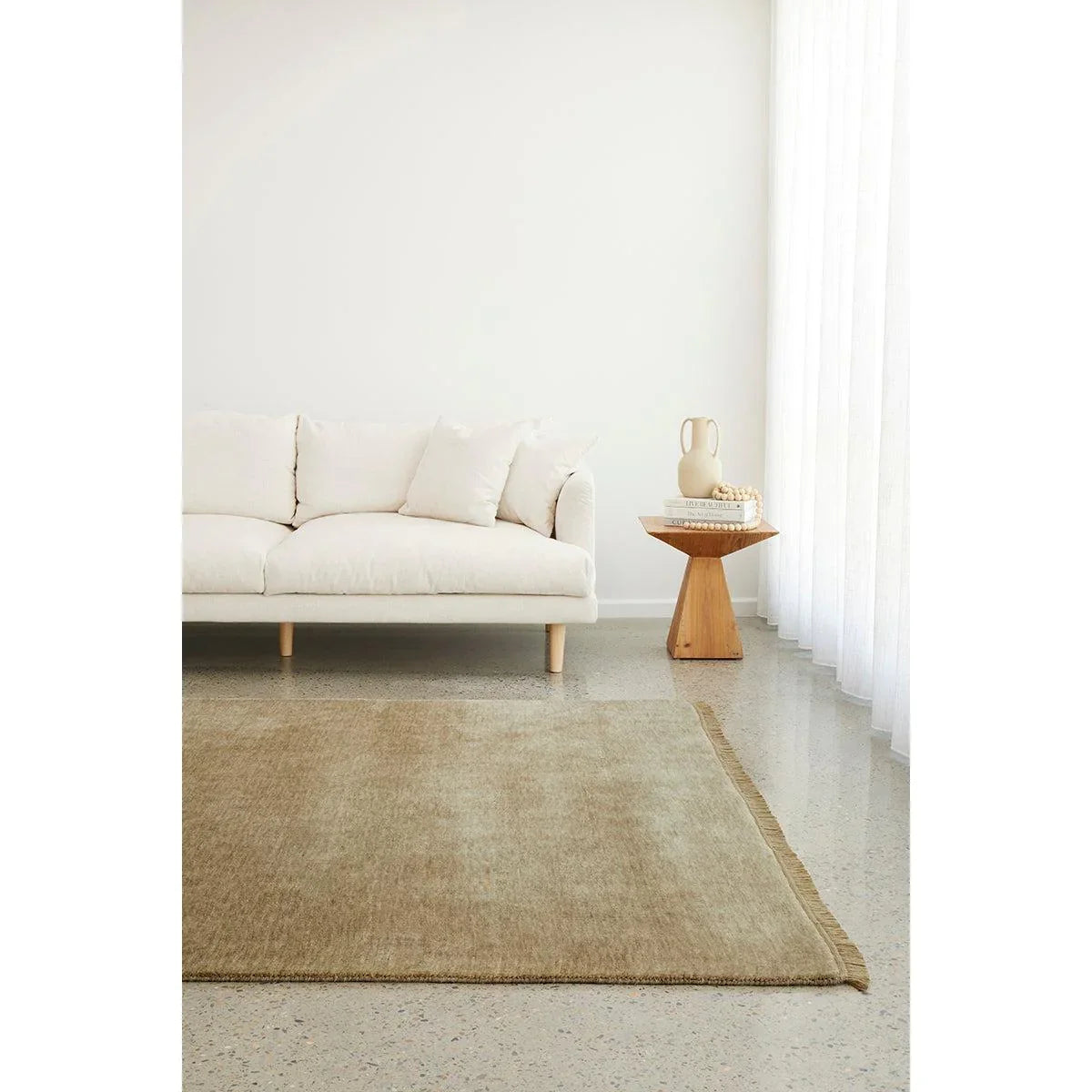 Conscious Loom Kinship Oyster Rug featuring solid minimalist design in oyster, beige and taupe on light floor, hand-woven wool