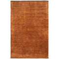 Conscious Loom Kinship Paprika Rug featuring solid burnt-orange texture on white background, handwoven wool
