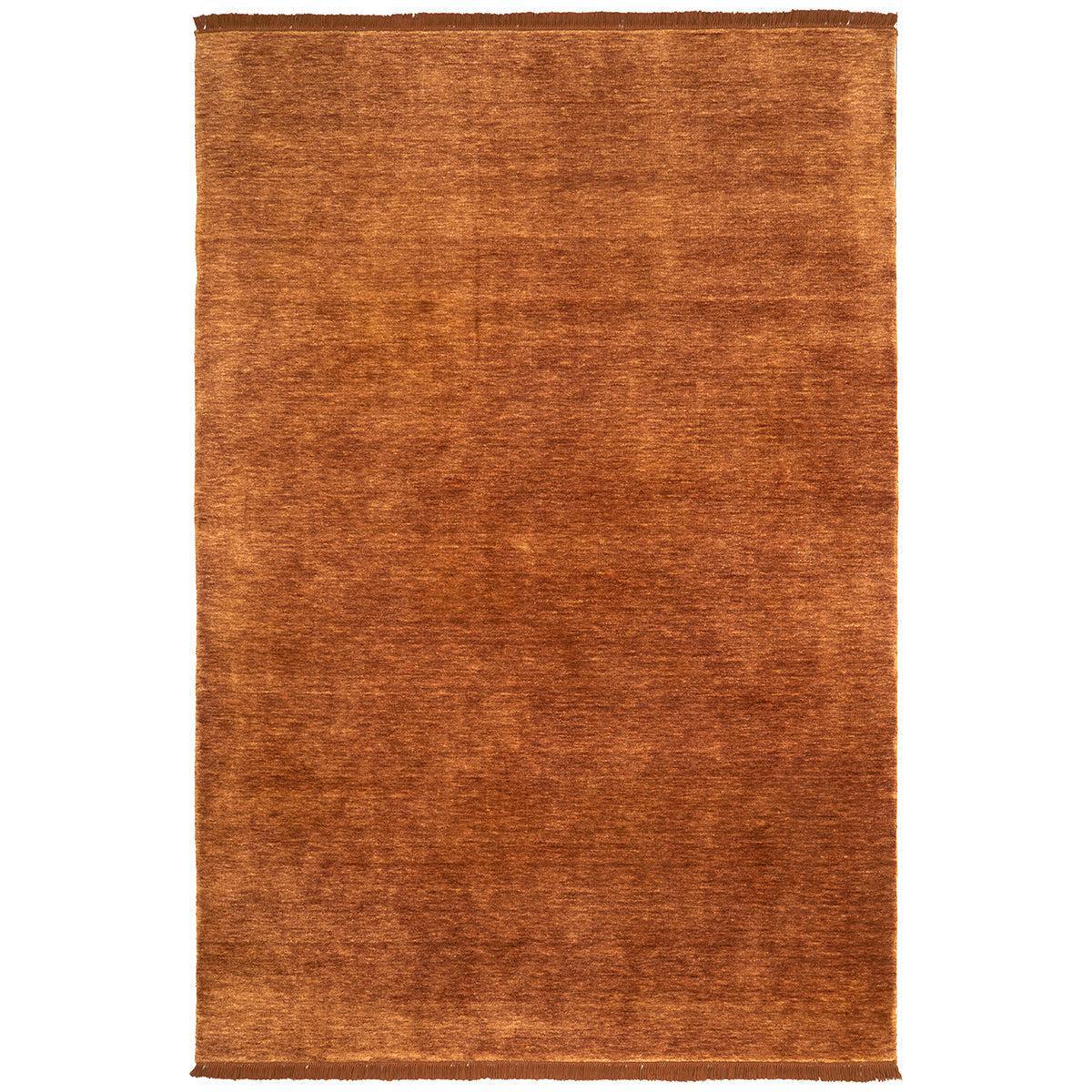 Conscious Loom Kinship Paprika Rug featuring solid burnt-orange texture on white background, handwoven wool