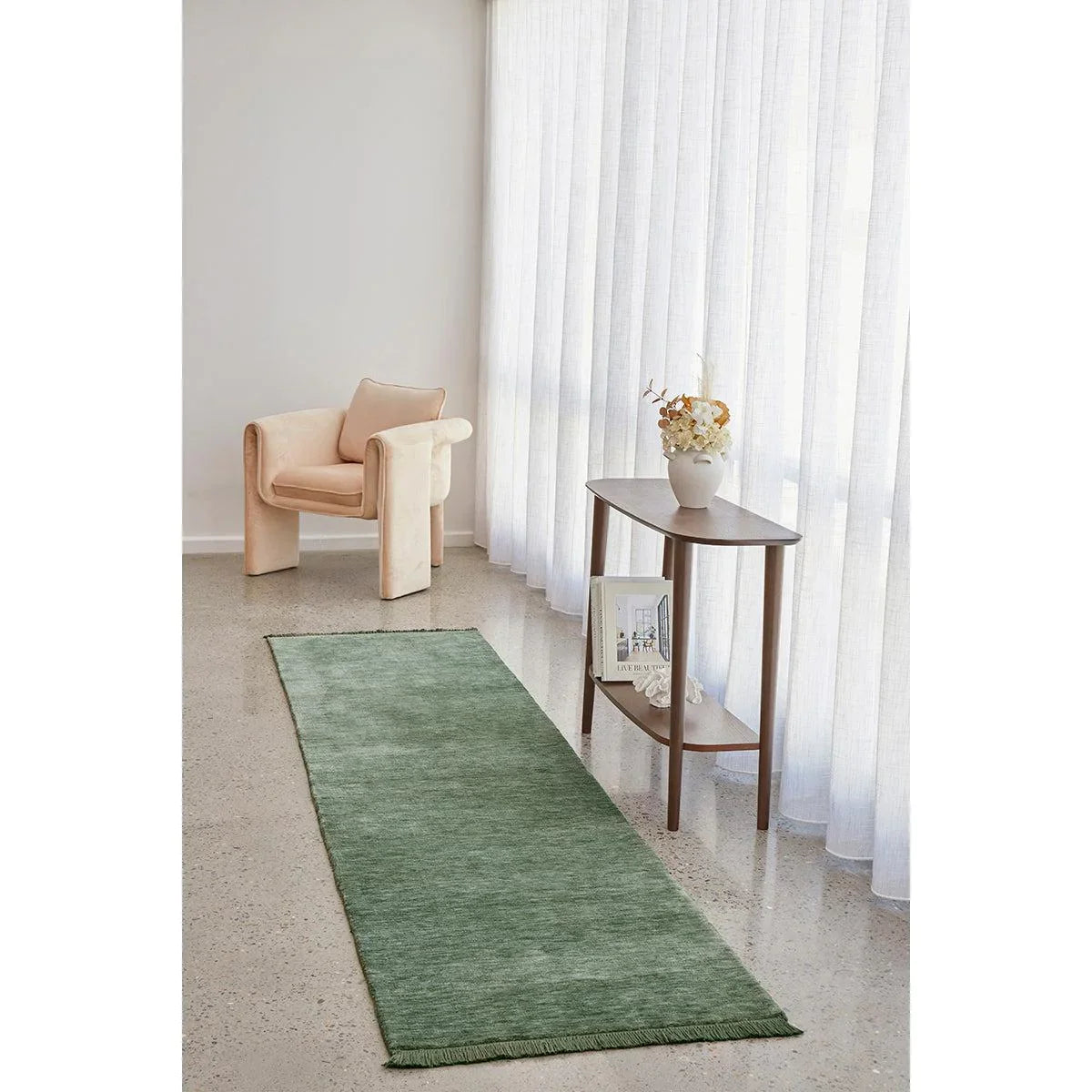 Conscious Loom Kinship Sage Green Rug featuring a runner in sage green on light cream floor, hand-loomed wool