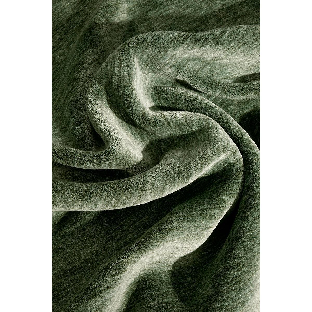 Conscious Loom Kinship Sage Green Runner Rug featuring fabric in sage, moss and forest greens on white, hand-tufted wool