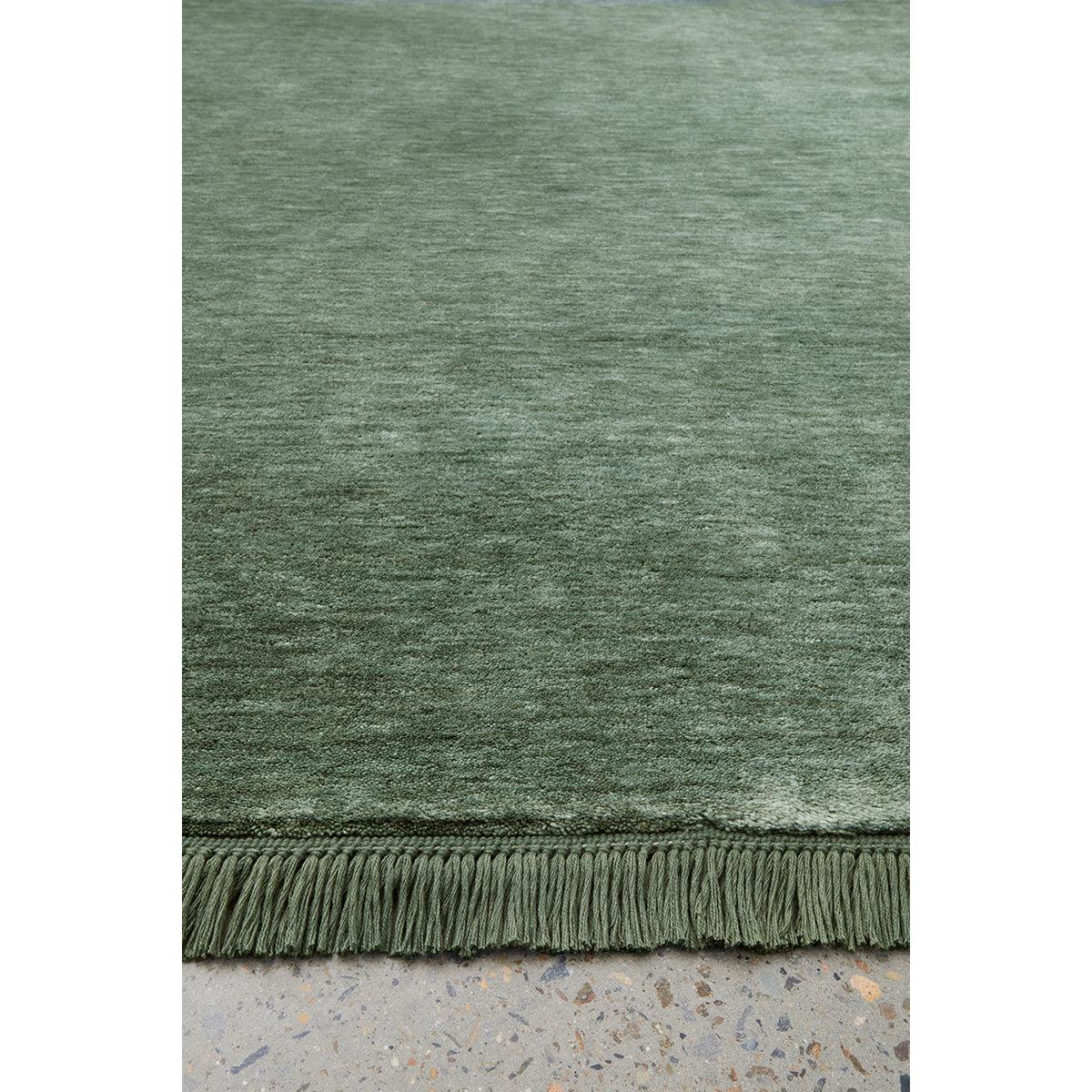 Conscious Loom Kinship Sage Green Rug featuring solid textured design in sage, moss and olive on grey background, woven wool
