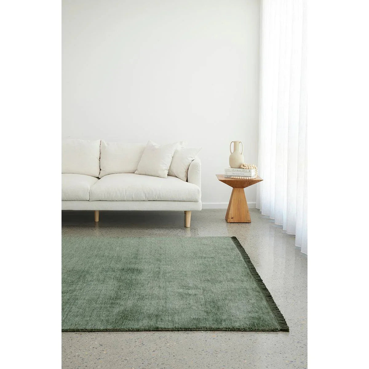 Conscious Loom Kinship Sage Green Rug featuring textured sage green on white background, handwoven wool