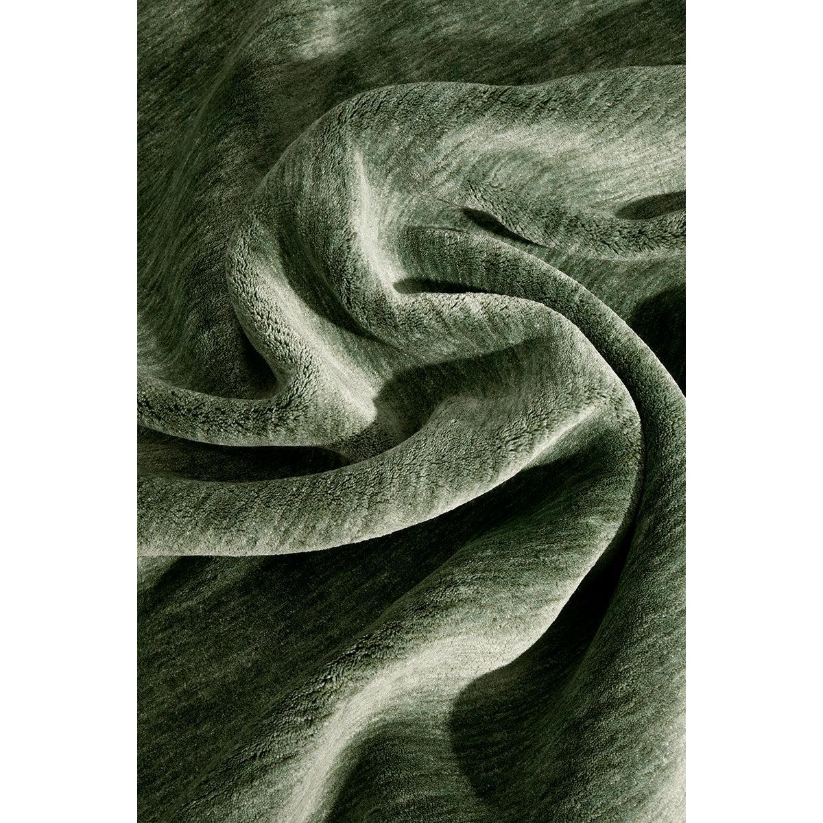 Conscious Loom Kinship Sage Green Rug featuring pattern in sage, olive green and forest green on white, hand-tufted wool